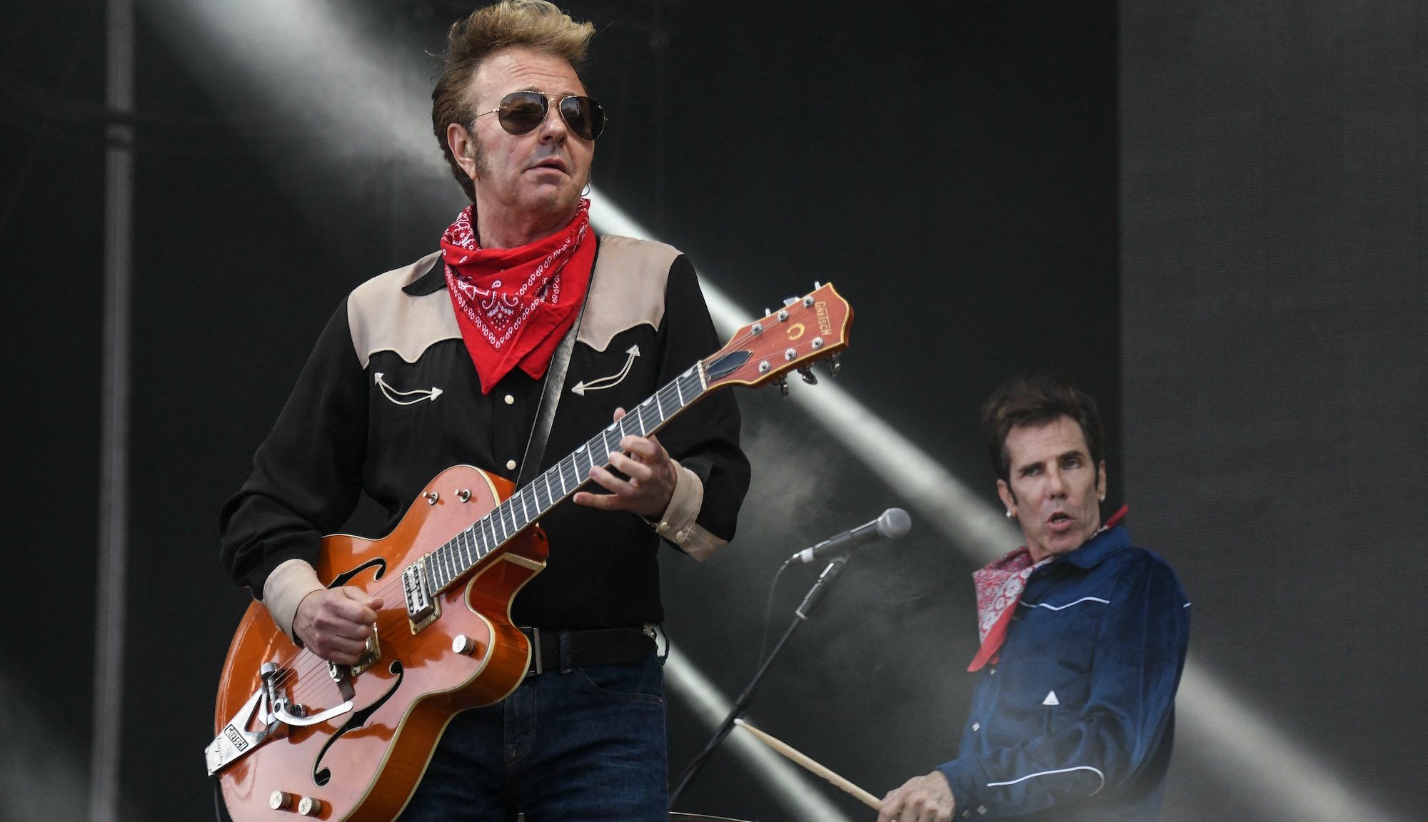 The Stray Cats' Brian Setzer (left) and Slim Jim Phantom perform onstage in Belfort, France on July 7, 2019